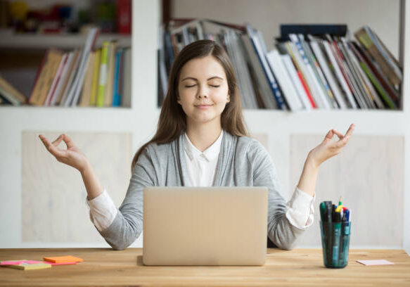 Calm woman relaxing meditating with laptop, no stress free relief at work concept, mindful peaceful young businesswoman or student practicing breathing yoga exercises at workplace, office meditation